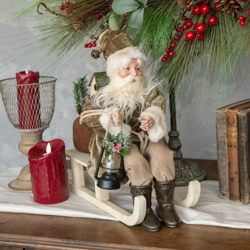 Santa on Sled with Olive Green Coat