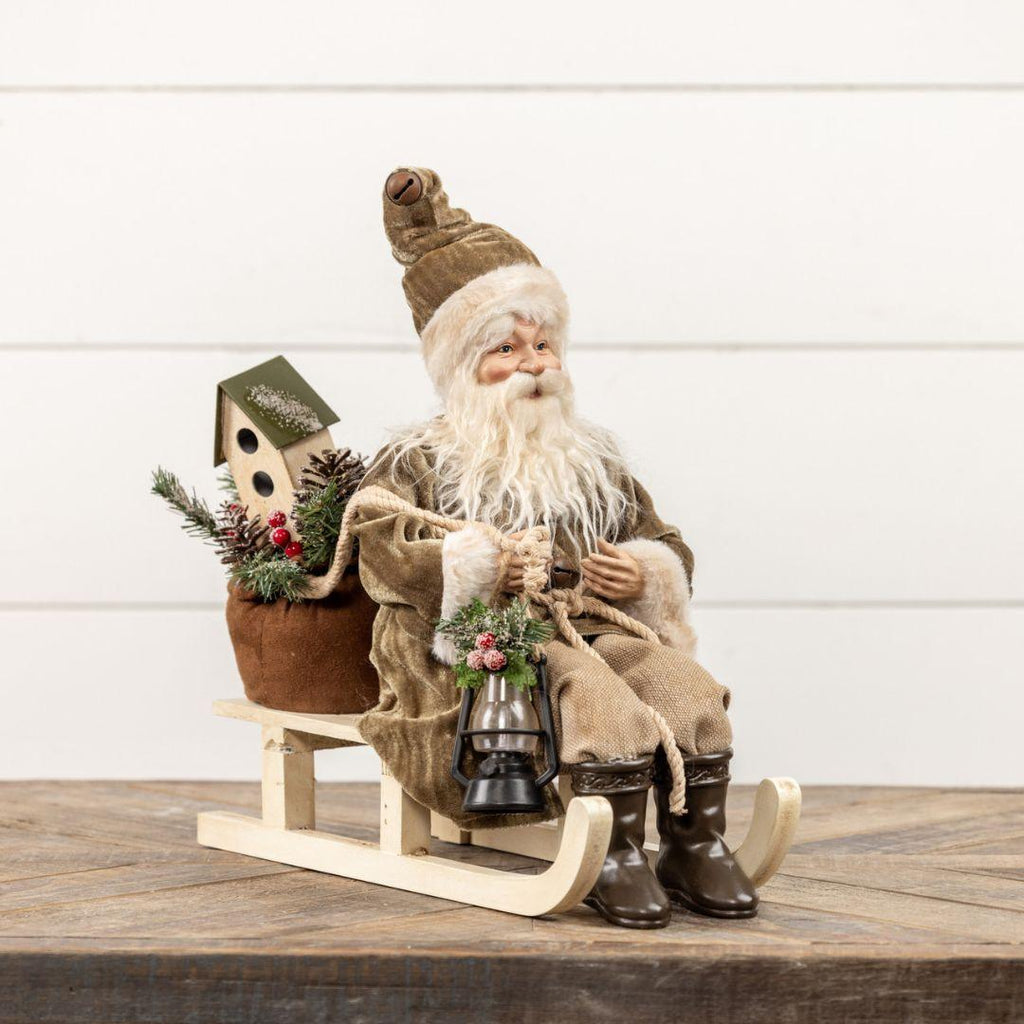 Santa on Sled with Olive Green Coat