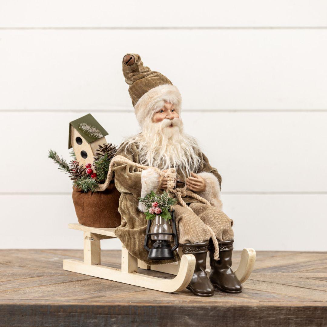 Santa on Sled with Olive Green Coat